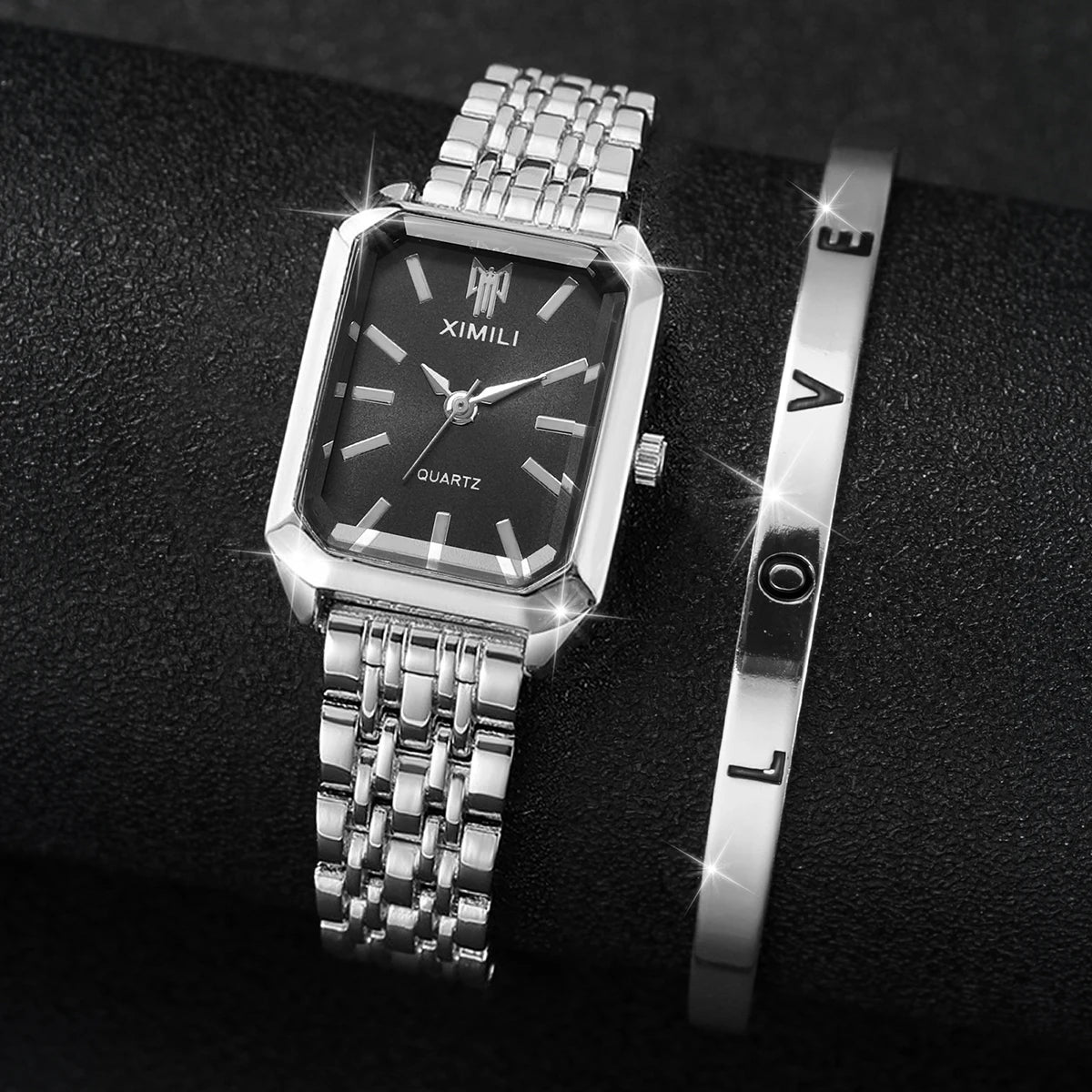 Relógio Ximili preto Feminino prateado com pulseira clássica no pulso