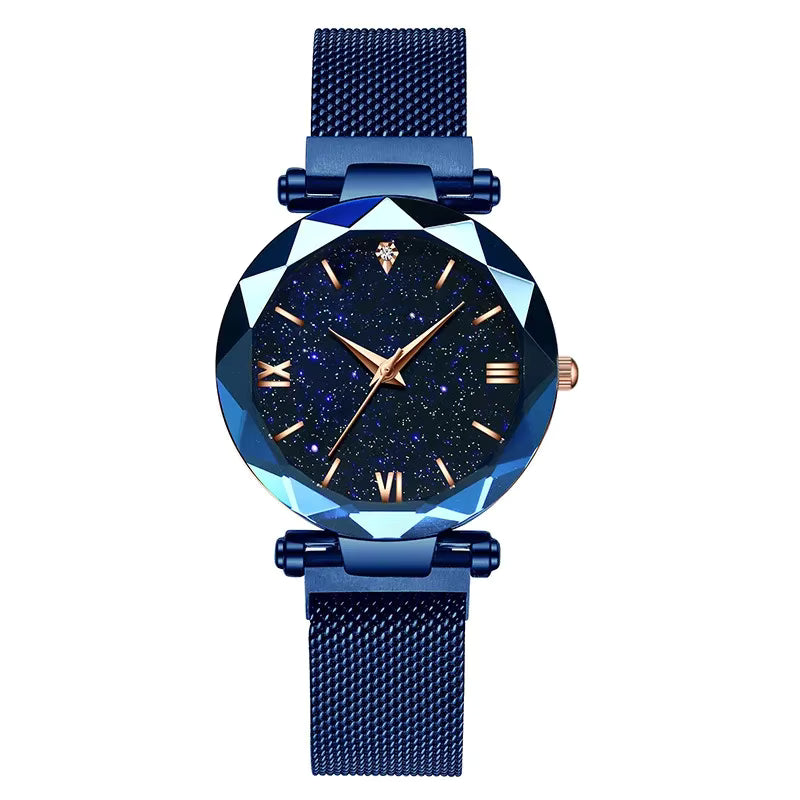 Relógio feminino azul com mostrador céu estrelado e pulseira moderna.