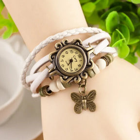 Relógio vintage branco com couro trançado e pingente borboleta feminino