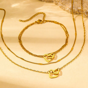 Conjunto com colar e pulseira em aço inox dourado ou prata com pingente de corações entrelaçados