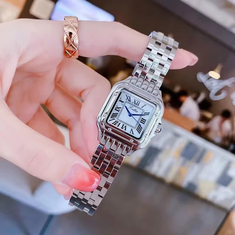 Relógio feminino GREALY prata com mostrador romano e pulseira aço inox.