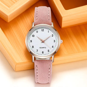 Relógio feminino retrô rosa claro com pulseira de couro sintético e mostrador luminoso.