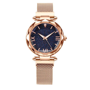 Relógio feminino rosa com mostrador estrelado e pulseira magnética.