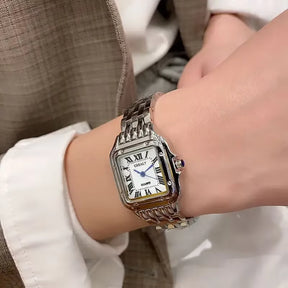 Relógio feminino GREALY prata com mostrador romano e pulseira aço inox.