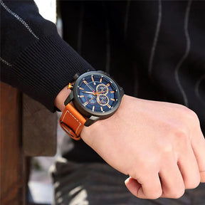 Relógio masculino Chronos com visor azul, cronógrafo e pulseira de couro marrom