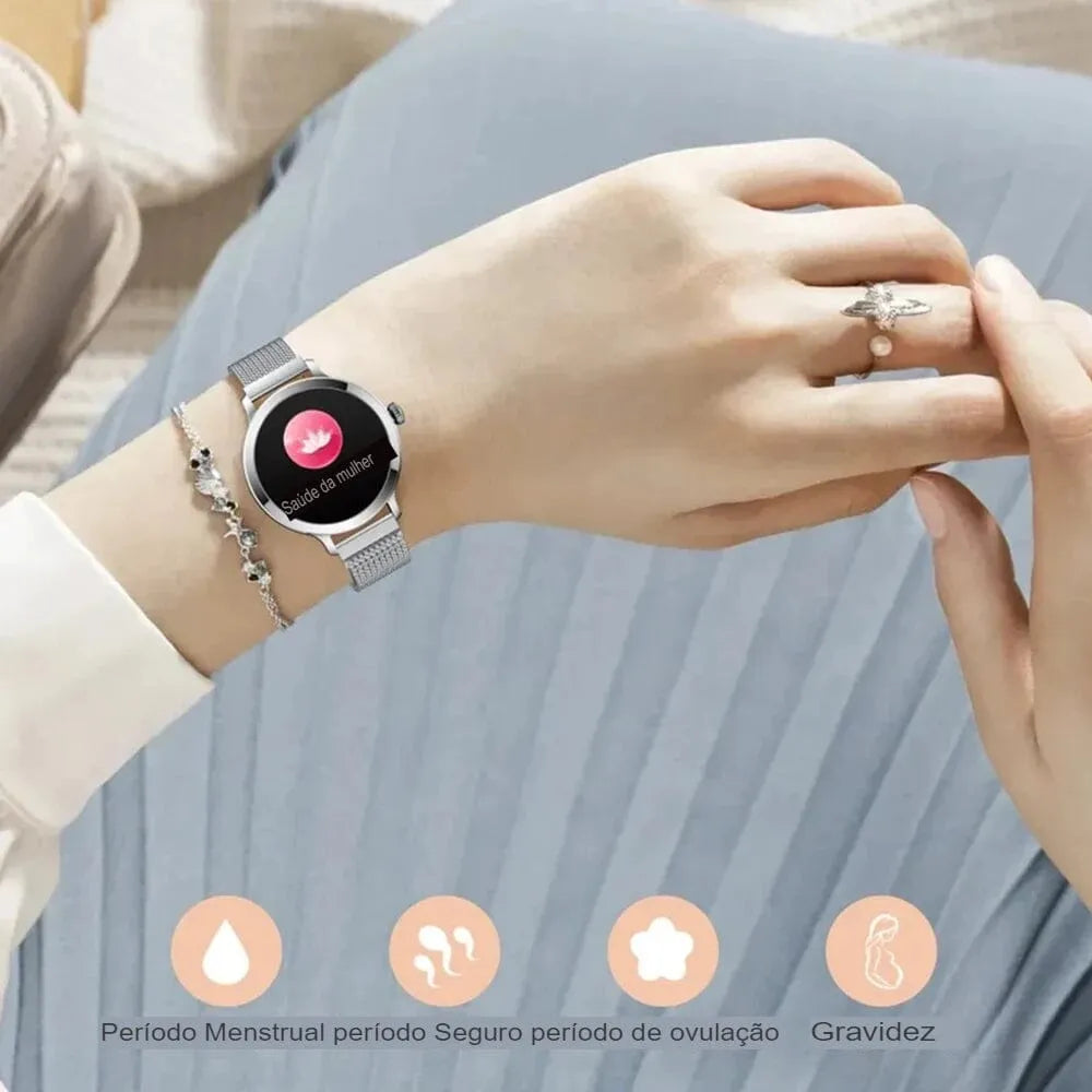 Smartwatch feminino prata com tela AMOLED, pulseira em aço fino e monitoramento de saúde completo.